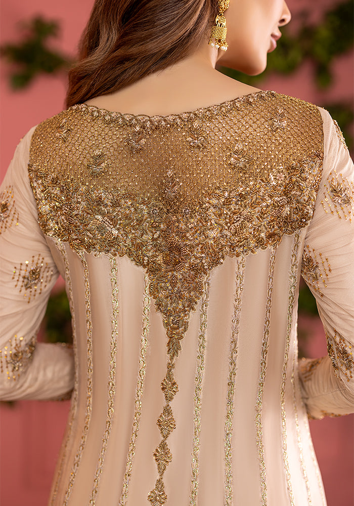 Zardozi and sequin work across the back yoke of an ivory shirt