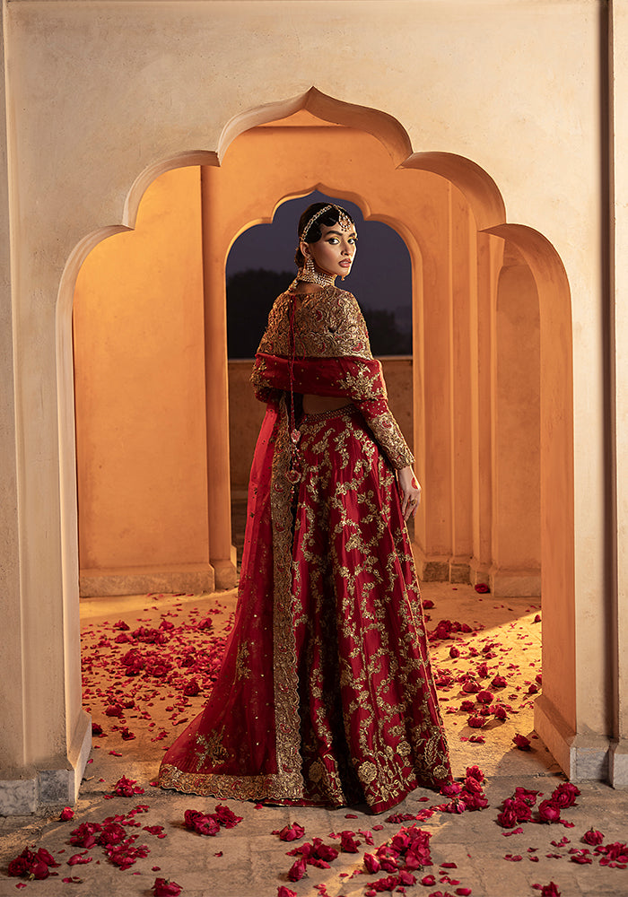 A Virasat bride under a saffron arch